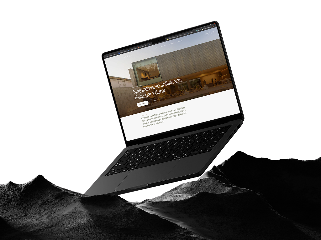 Site da Pura Revestimentos em notebook sobre superfície rochosa Site da Pura Revestimentos em notebook sobre superfície rochosa.